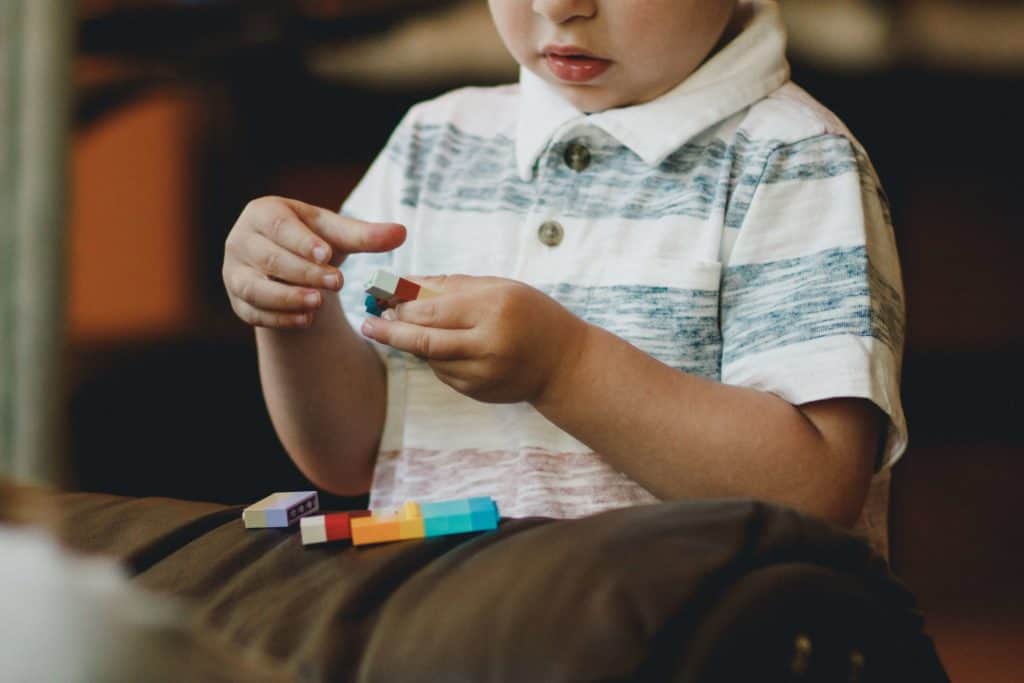 A boy working with sensory toys as we learn more about Autism Awareness Month