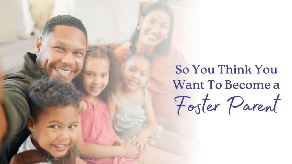 A couple who thinks they want to become foster parents sits on the couch with their foster children and takes a selfie together.