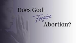 picture of woman praying asking does God forgive abortion