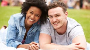 Interethnic couple smiling at the camera