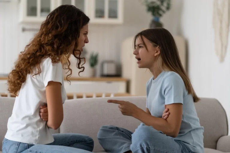 Disrespectful teenage girl arguing and pointing her finger at her mom