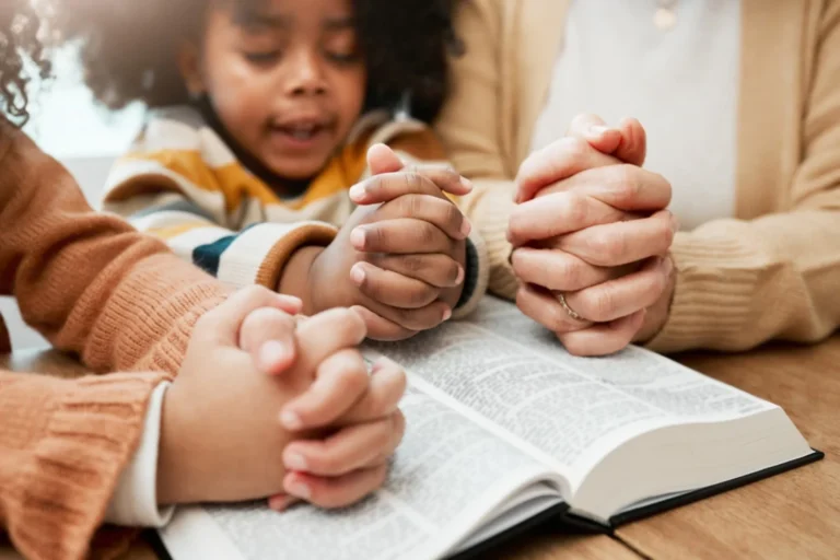 family praying together.