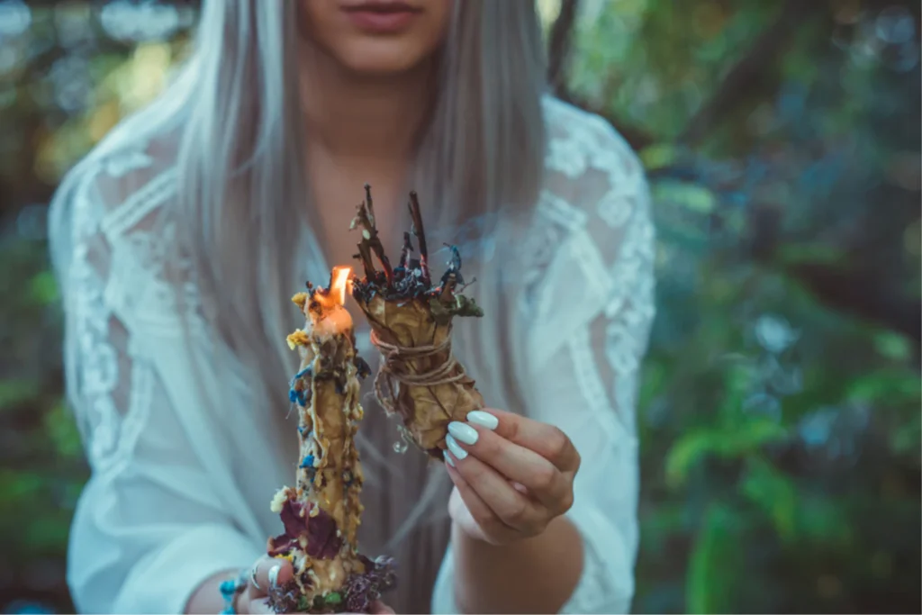 Young woman using Wicca candles